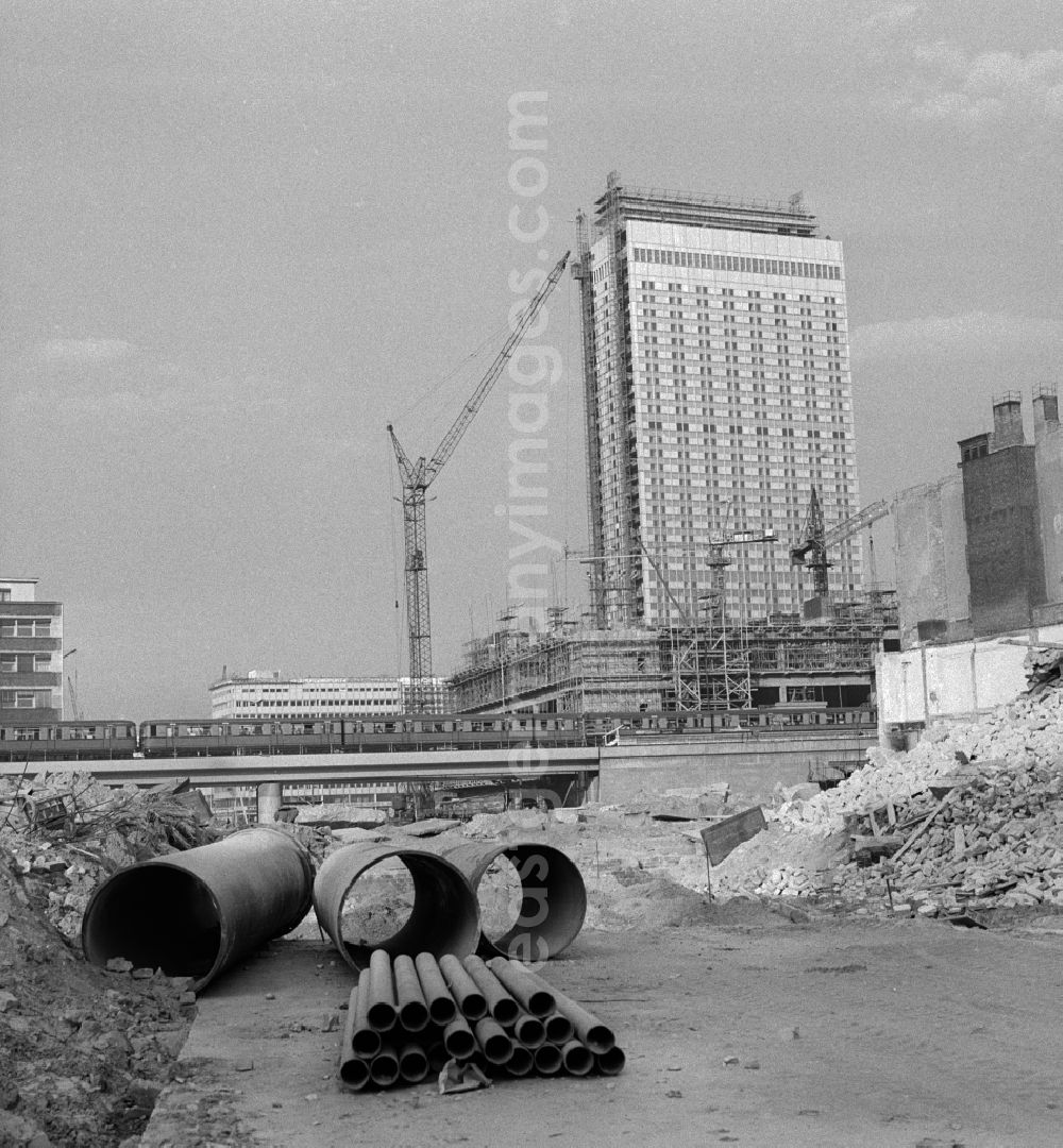 GDR picture archive: Berlin - Mitte - Extensive demolition of buildings at the Kaiser-Wilhelm-Straße today Karl-Liebknecht-Straße in Berlin - Mitte. In the background the newly built Hotel Stadt Berlin