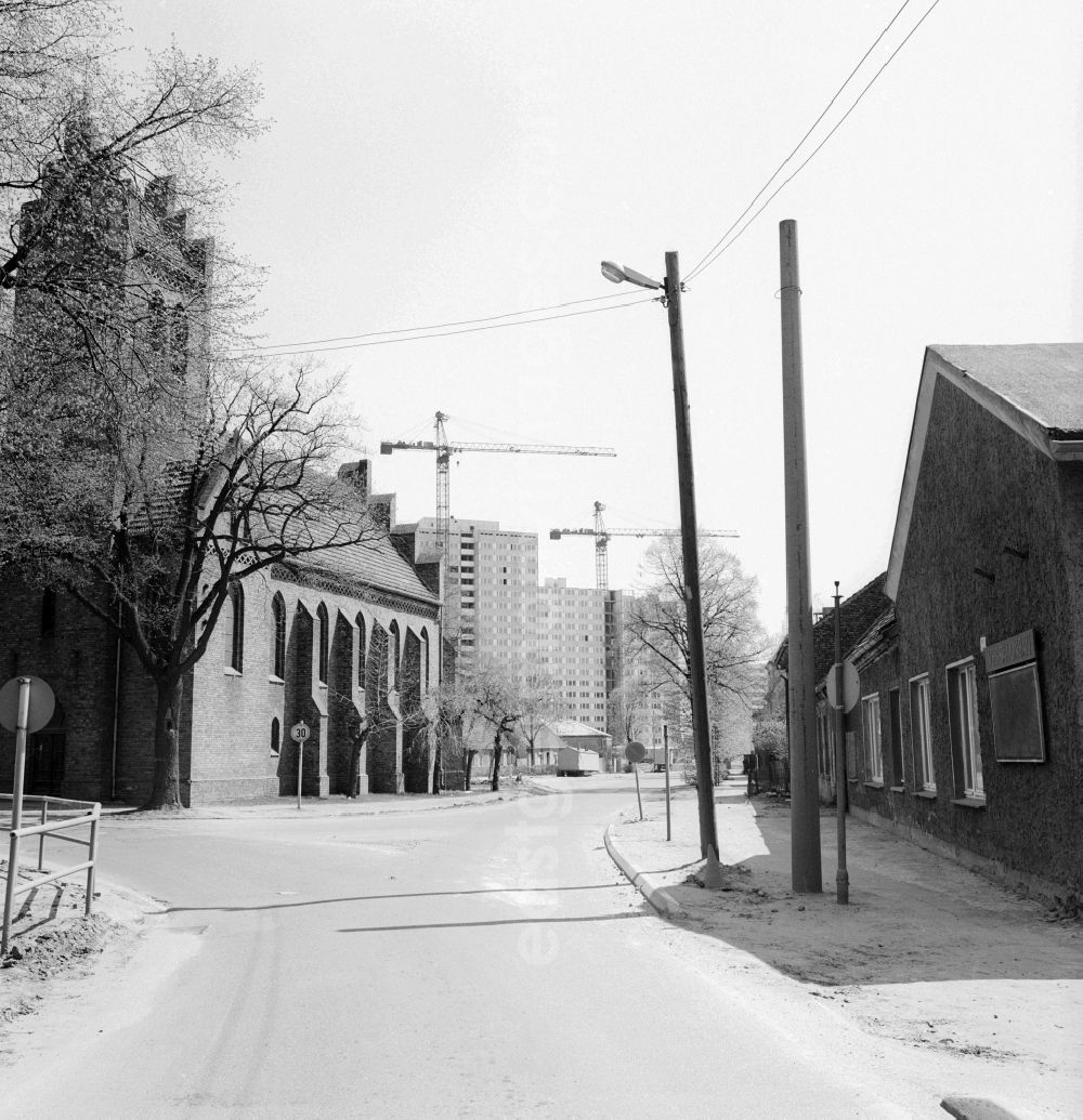 GDR photo archive: Berlin - Old Marzahn with the village church in front of the new apartment buildings in Berlin, the former capital of the GDR, German Democratic Republic