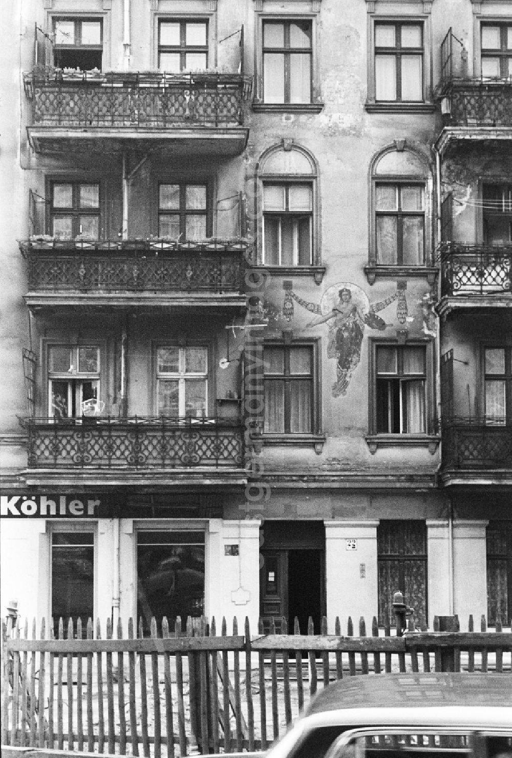 GDR photo archive: Berlin - Old building facade with balconies and art painting in Berlin, the former capital of the GDR, German democratic republic