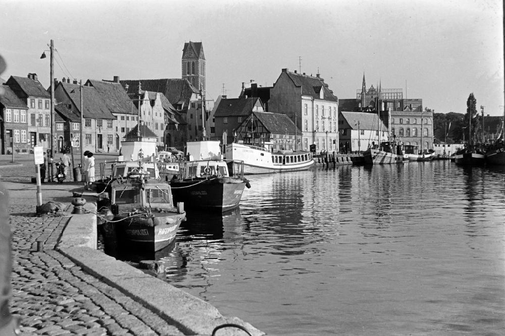 GDR photo archive: Wismar - Harbor police ships lying at anchor and moored in the city harbor on Lagerstrasse in Wismar, Mecklenburg-Western Pomerania on the territory of the former GDR, German Democratic Republic