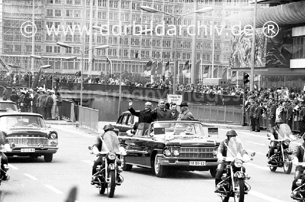 GDR photo archive: Berlin - April 1973 Berlin Alexanderplatz. Besuch vom sowjetischen Generalsekretär Leonid Breschnew in Berlin. Erich Honecker und Leonid Breschnew winken aus dem fahrenden Auto.