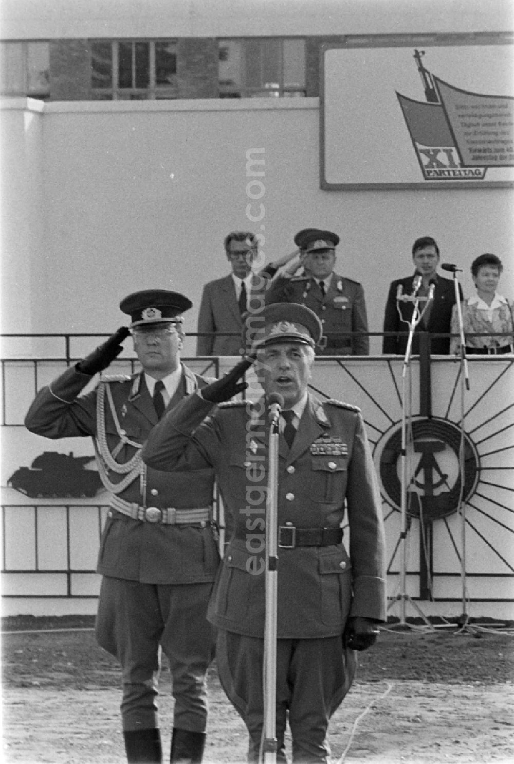 GDR image archive: Goldberg - Honorary grandstand with Major General Horst Stechbarth and soldiers and officers of Panzer Regiment 8 (PR-8) on the occasion of the ceremonial and media-effective dissolution of the troop unit on the grounds of the Artur-Becker barracks in Goldberg in the state of Mecklenburg-Western Pomerania in the area of the former GDR, German Democratic Republic