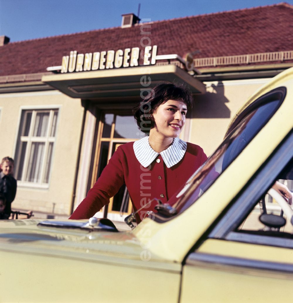 GDR image archive: Dresden - A model poses at a car AWZ P5