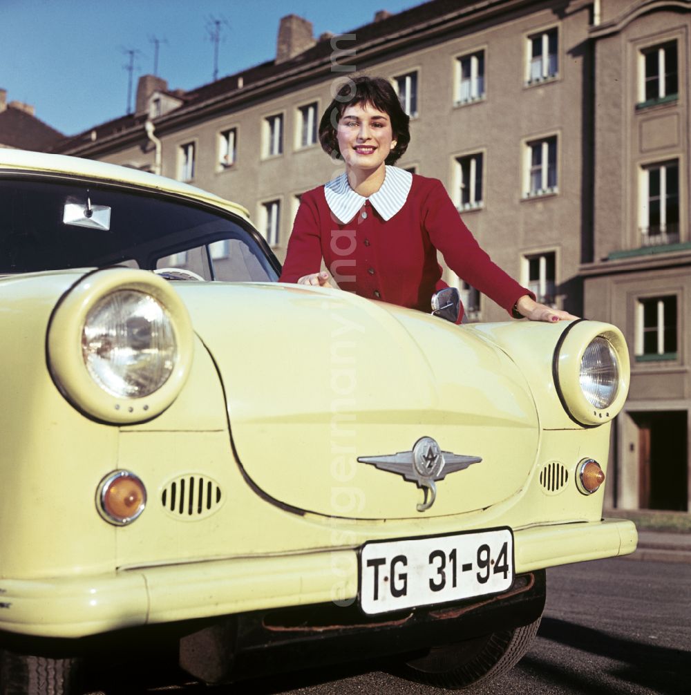 GDR image archive: Dresden - A model poses at a car AWZ P5