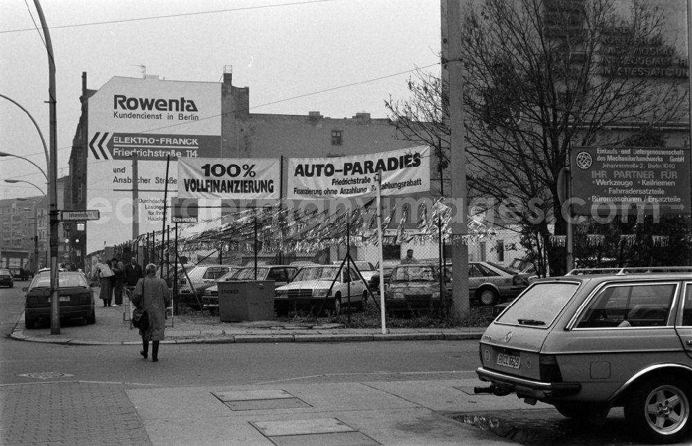 GDR photo archive: Berlin - The car dealer Auto-Paradies sells Westautos in the Friedrichstrasse corner Johannisstrasse in Berlin - Mitte, the former capital of the GDR, German Democratic Republic