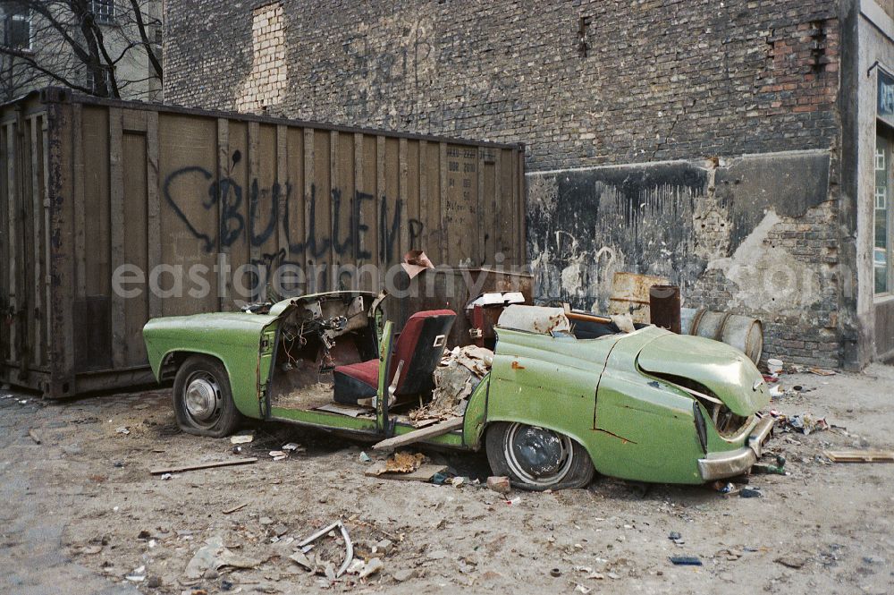 GDR image archive: Berlin - Wreck and junk debris Wartburg 311 on street Frankfurter Allee in the district Friedrichshain in Berlin Eastberlin on the territory of the former GDR, German Democratic Republic