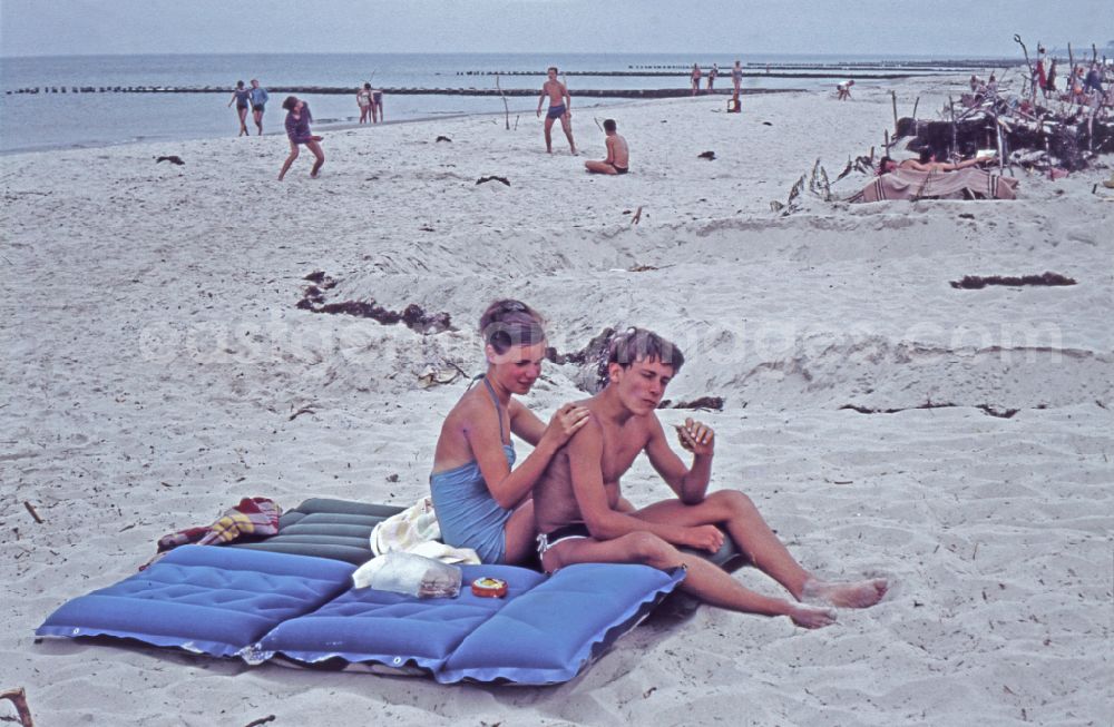GDR photo archive: Born a. Darß - Vacationers and tourists as bathers on the sandy beachthe Baltic Sea in Born a. Darss, Mecklenburg-Western Pomerania on the territory of the former GDR, German Democratic Republic