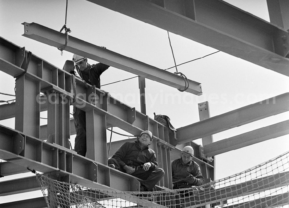 GDR photo archive: Berlin - Construction workers secured with ropes and carabiners during steel girder work on the Berlin TV Tower in the district Mitte in Berlin, the former capital of the GDR, German Democratic Republic