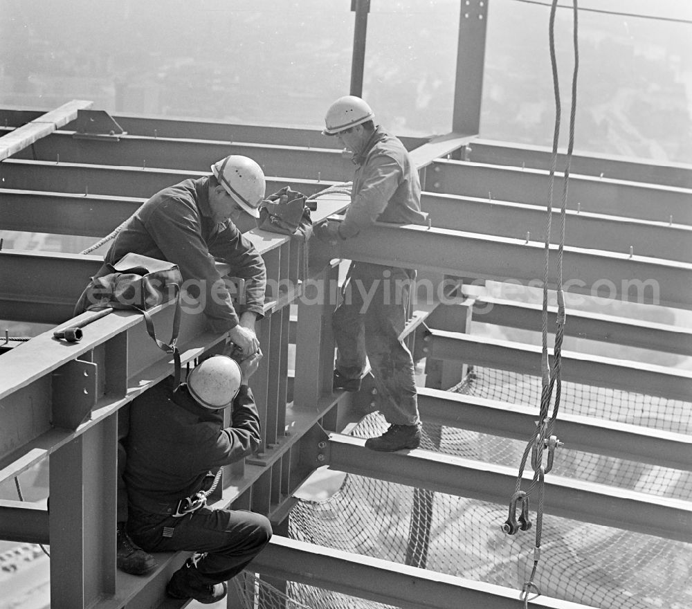 GDR image archive: Berlin - Construction workers secured with ropes and carabiners during steel girder work on the Berlin TV Tower in the district Mitte in Berlin, the former capital of the GDR, German Democratic Republic