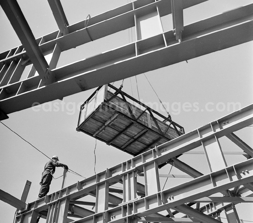 GDR picture archive: Berlin - Building material at the crane on the Berlin TV tower in the district Mitte in Berlin, the former capital of the GDR, German Democratic Republic