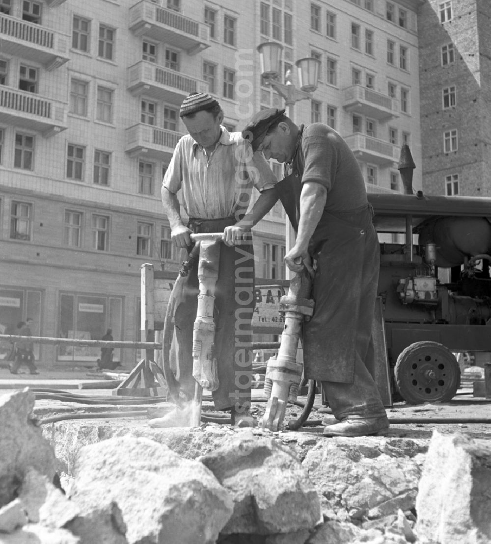 GDR image archive: Berlin - Road construction work in the newly built Stalinallee (now Karl-Marx-Allee) in the Friedrichshain district of East Berlin in the territory of the former GDR, German Democratic Republic