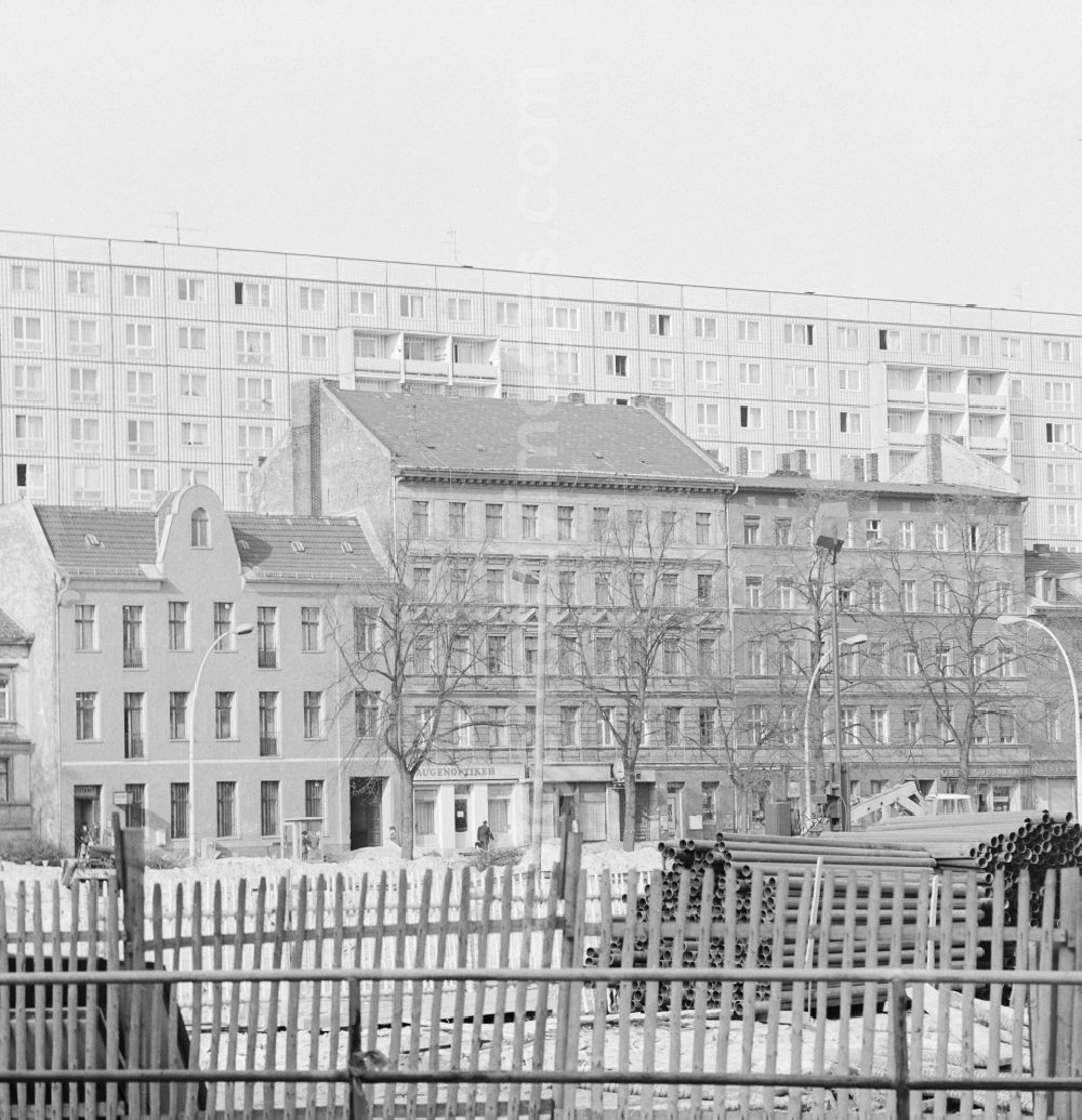 GDR picture archive: Berlin - Construction site, construction of the new B1 Alt-Friedrichsfelde in Berlin, the former capital of the GDR, the German Democratic Republic. In the background are old and new buildings