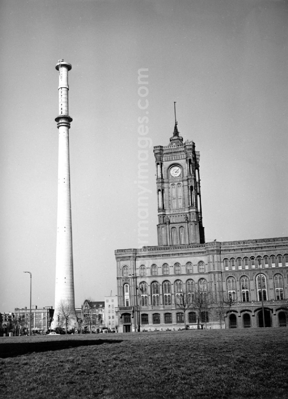 GDR picture archive: Berlin - Berliner Fernsehturm in the phase of the shell construction as a striking tower structure against the Red townhall in the district Mitte in Berlin, the former capital of the GDR, German Democratic Republic