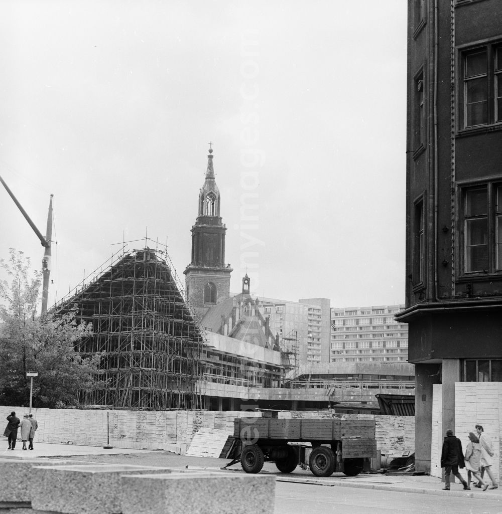 GDR photo archive: Berlin - Construction site for the new Berlin television tower in Berlin, the former capital of the GDR, German Democratic Republic. In the background the Marienkirche on Karl-Liebknecht-Strasse