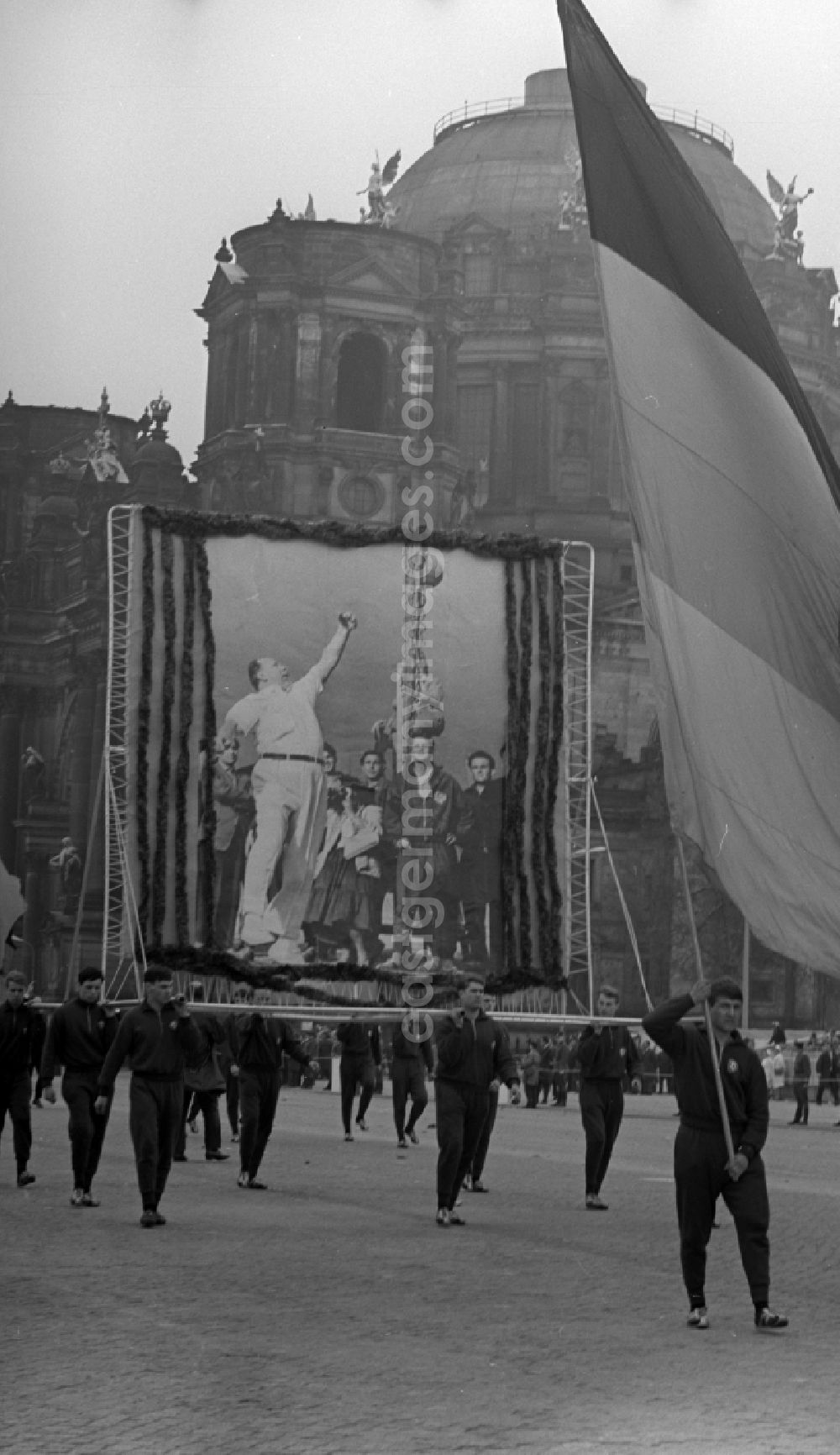 GDR photo archive: Berlin Mitte - Enthusiastic members of the SC Dynamo Berlin with flags, banners and slogans while parading at the VIP stand to fight and holiday of the 1st On May Schlossplatz in Berlin - Mitte
