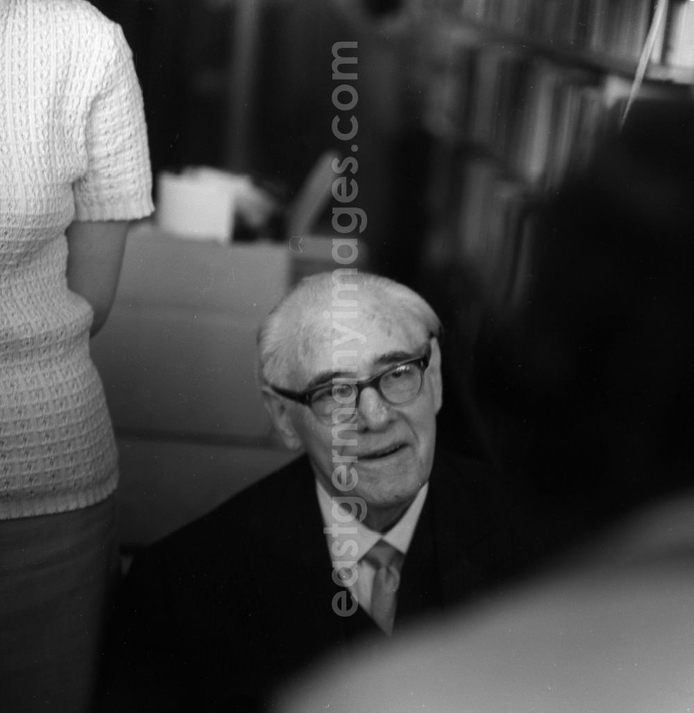 Berlin Mitte: Well-known East German writer and novelist John Tralow (pseudonym Hanns Low) on a book bazaar on the occasion of the 1st May in Berlin - Mitte