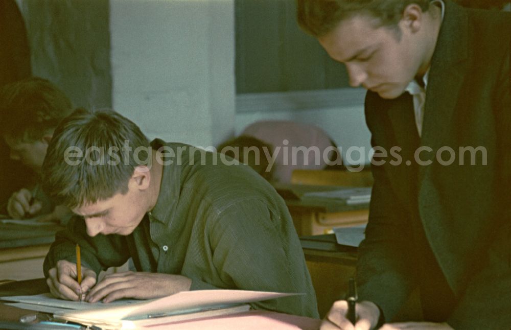 GDR photo archive: Berlin - Mathematics lessons in an electromechanical - apprenticeship class in the teaching cabinet of the vocational school of the VEB Elektro-Apparate-Werke in the district of Treptow in Berlin East Berlin on the territory of the former GDR, German Democratic Republic