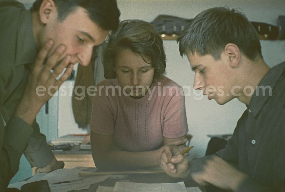 GDR picture archive: Berlin - Mathematics lessons in an electromechanical - apprenticeship class in the teaching cabinet of the vocational school of the VEB Elektro-Apparate-Werke in the district of Treptow in Berlin East Berlin on the territory of the former GDR, German Democratic Republic