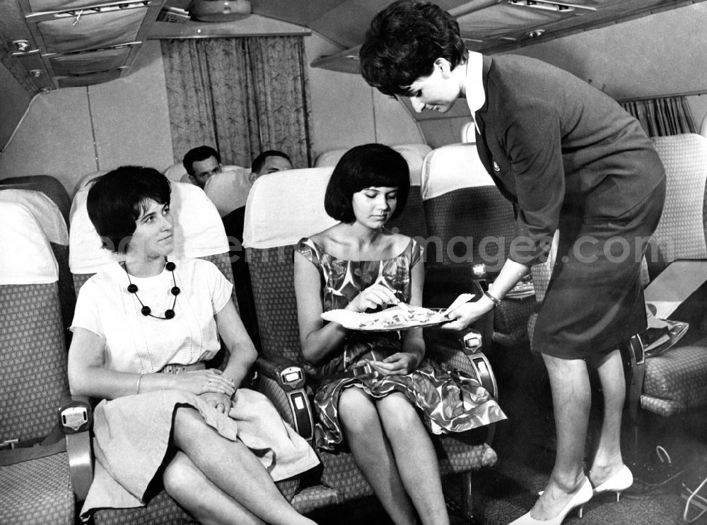 GDR picture archive: Schönefeld - Practical training for future stewardesses in the fuselage of an IL-18 in Schoenefeld in the state Brandenburg on the territory of the former GDR, German Democratic Republic