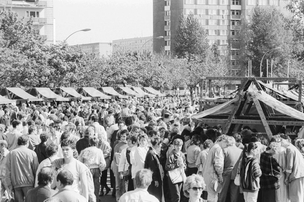 GDR picture archive: Berlin - Visitors at stage events at the fair for public entertainment during the 1st of may at the Alexanderplatz in Berlin in Germany