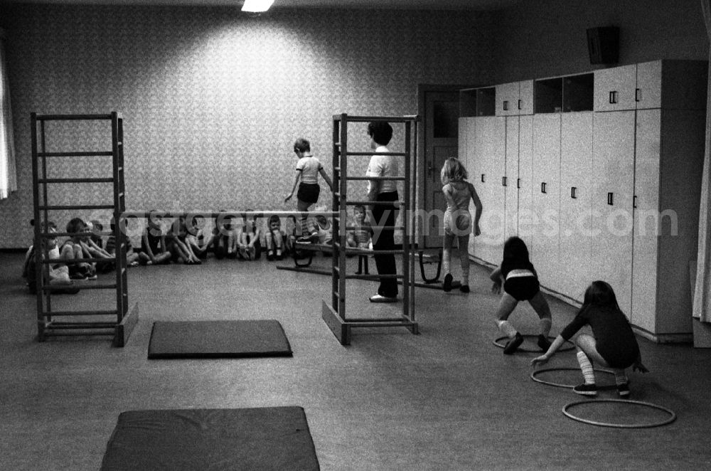 GDR picture archive: Berlin - Games and fun with toddlers in kindergarten in physical education in a gym in Berlin Eastberlin on the territory of the former GDR, German Democratic Republic