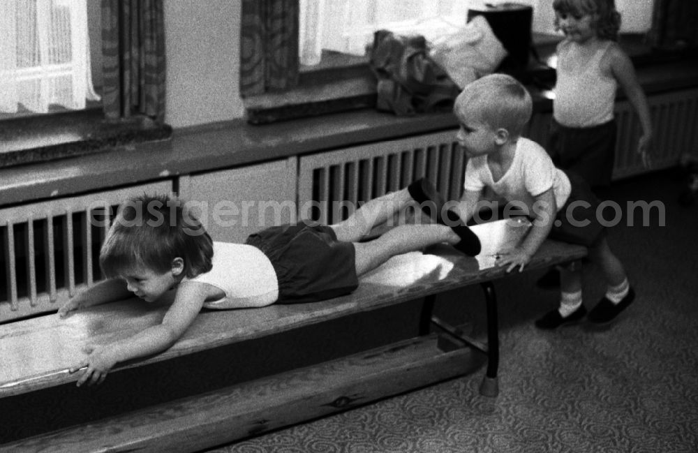 GDR picture archive: Berlin - Games and fun with toddlers in kindergarten in physical education in a gym in Berlin Eastberlin on the territory of the former GDR, German Democratic Republic
