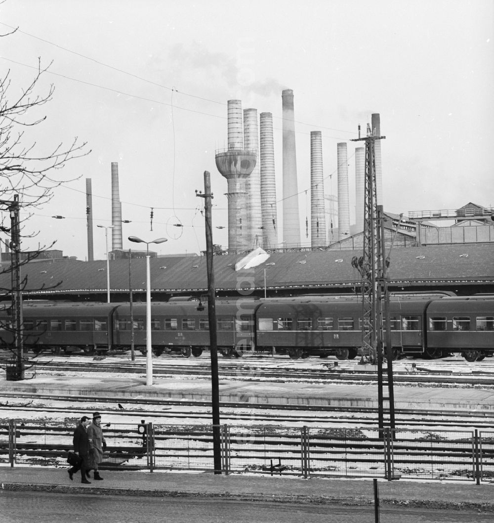 GDR picture archive: Riesa - Overlooking the grounds of the Deutsche Reichsbahn in Riesa in Saxony in the area of the former GDR, German Democratic Republic. In the background the chimneys of the steelworks