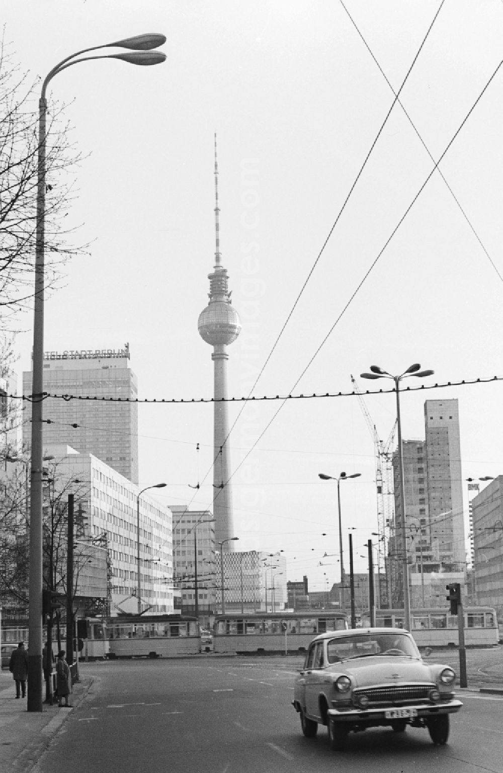 GDR image archive: Berlin - View from the Prenzlauer Allee on the Karl-Liebknecht-Strasse towards Alexanderplatz in Berlin. In the background of the Berlin TV Tower, the Hotel Stadt Berlin and the Centrum department store at Alexanderplatz