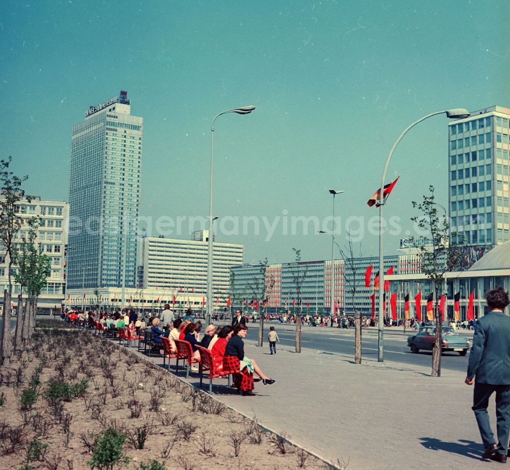 GDR image archive: Berlin - View in the direction of the Berliner Verlag decorated with flags Alexander street in Berlin. On the left is the Hotel Stadt Berlin