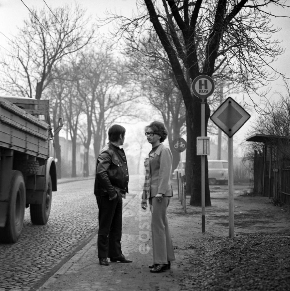 GDR photo archive: Berlin - Passengers getting on and off at a bus stop trolleybus in the district Friedrichshain in Berlin, the former capital of the GDR, German Democratic Republic
