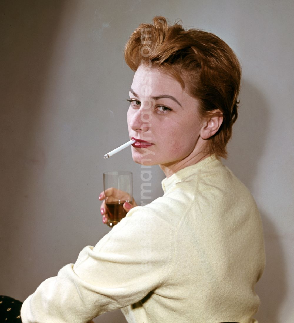 GDR image archive: Berlin - Actress Christine Laszar smokes a cigarette in East Berlin on the territory of the former GDR, German Democratic Republic