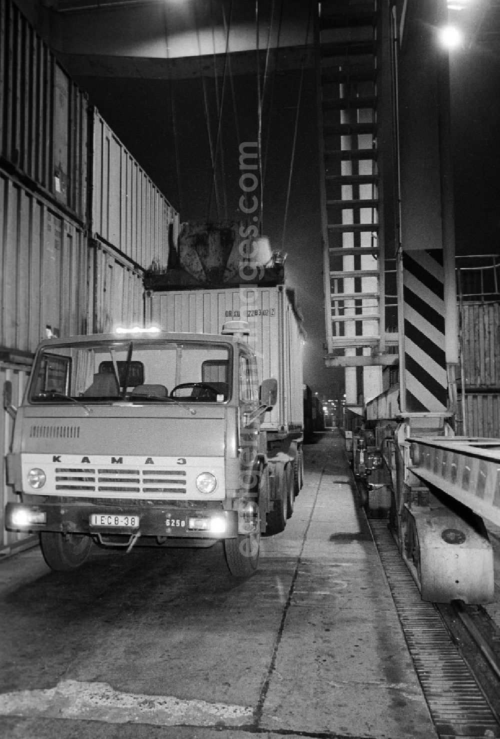 GDR photo archive: Berlin - A truck will load with a container in the container terminal Frankfurt avenue in Berlin, the former capital of the GDR, German democratic republic