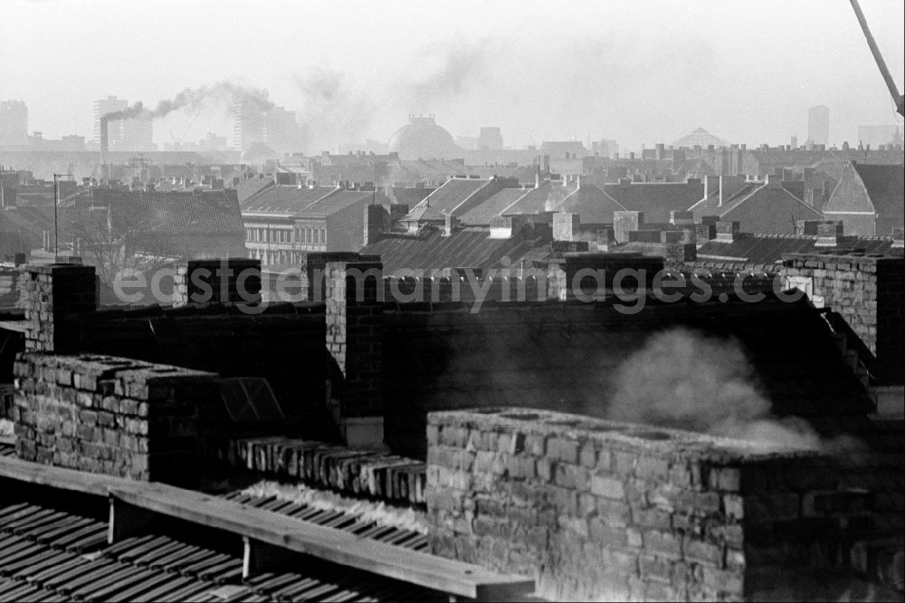 GDR picture archive: Berlin - View over the roofs in winter during the heating season in East Berlin on the territory of the former GDR, German Democratic Republic