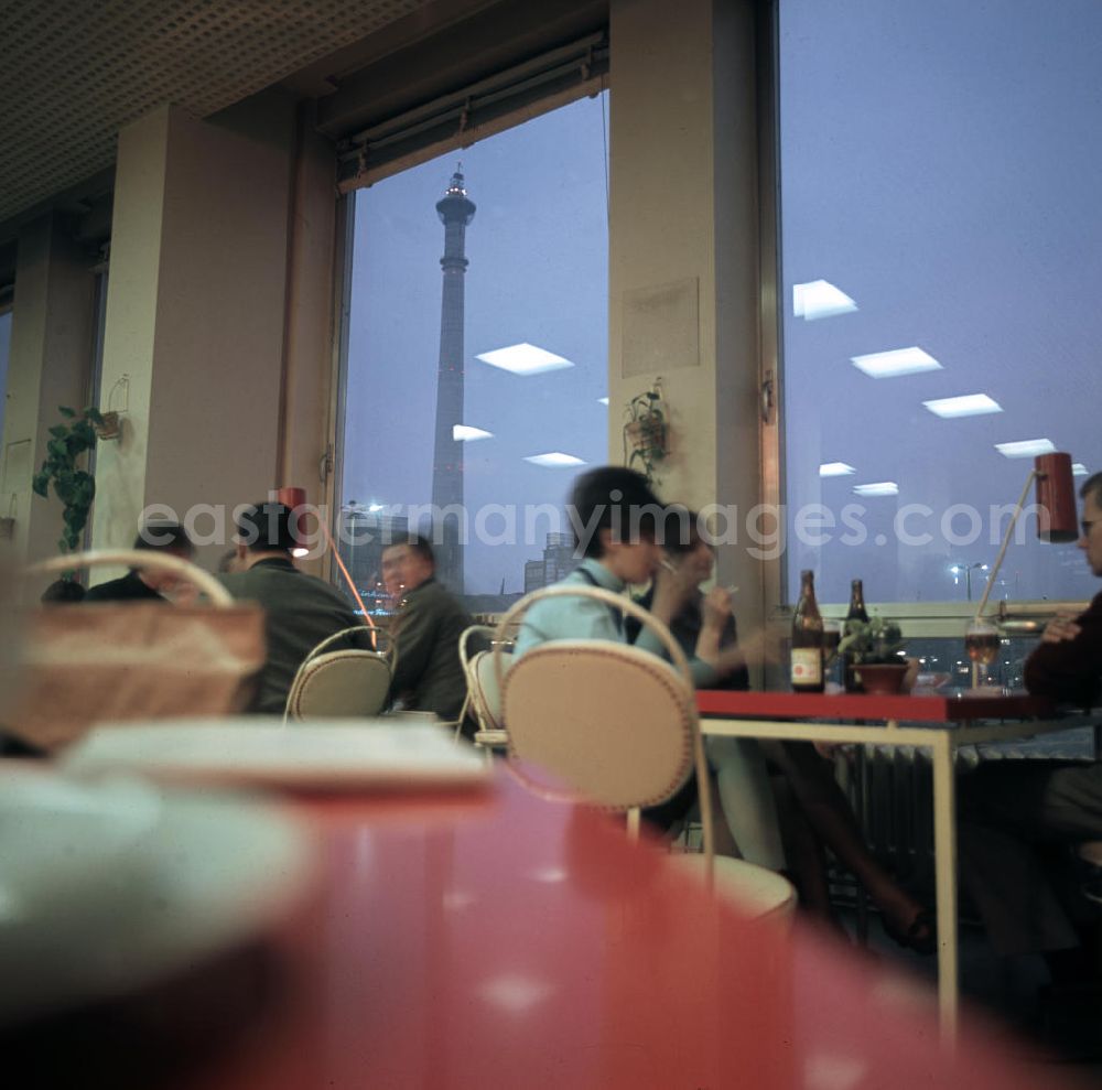 GDR photo archive: Berlin - Blick auf den im Bau befindlichen Fernsehturm aus dem Cafe im Haus des Lehrers am Alexanderplatz in Berlin.