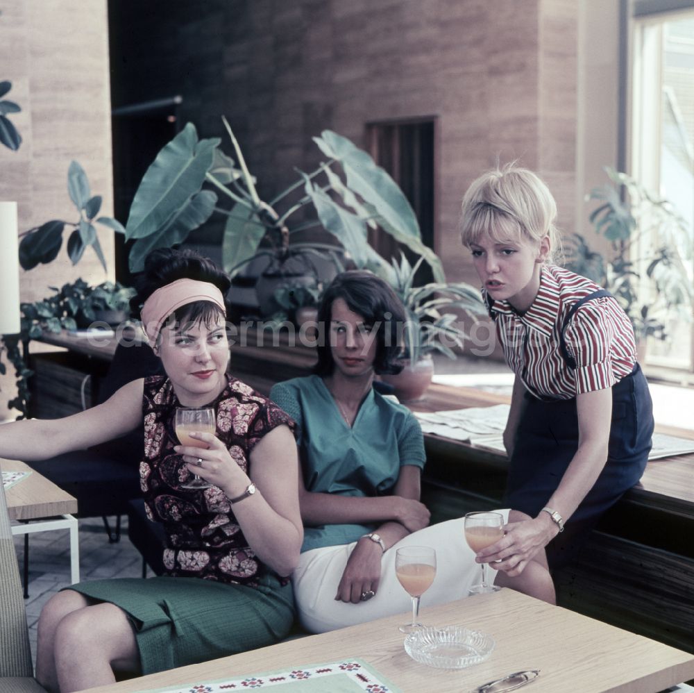 GDR photo archive: Berlin - Young women present the latest summer fashion in Eastberlin on the territory of the former GDR, German Democratic Republic. Sabine Bergmann-Pohl In the middle