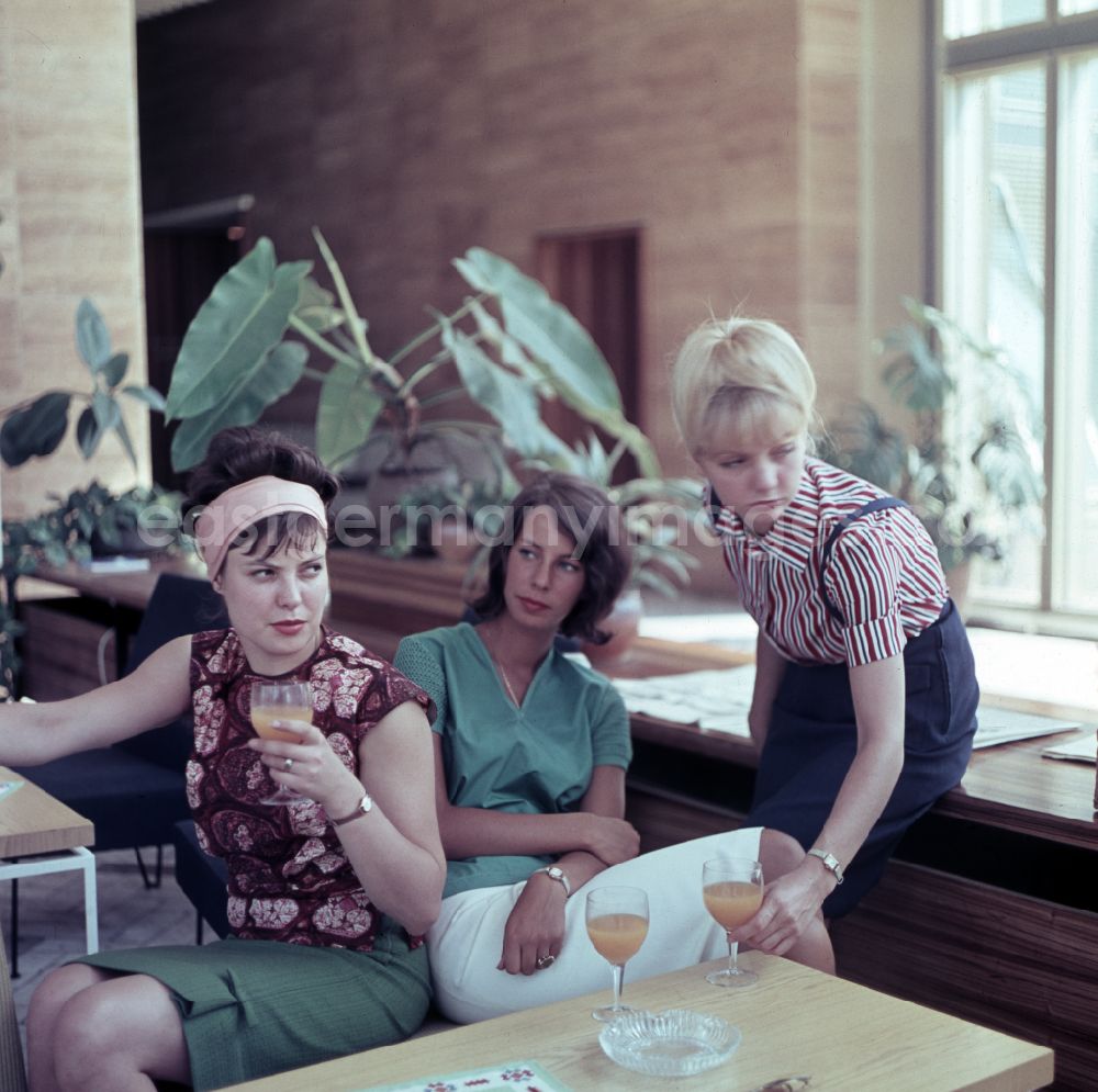 GDR picture archive: Berlin - Young women present the latest summer fashion in Eastberlin on the territory of the former GDR, German Democratic Republic. Sabine Bergmann-Pohl In the middle
