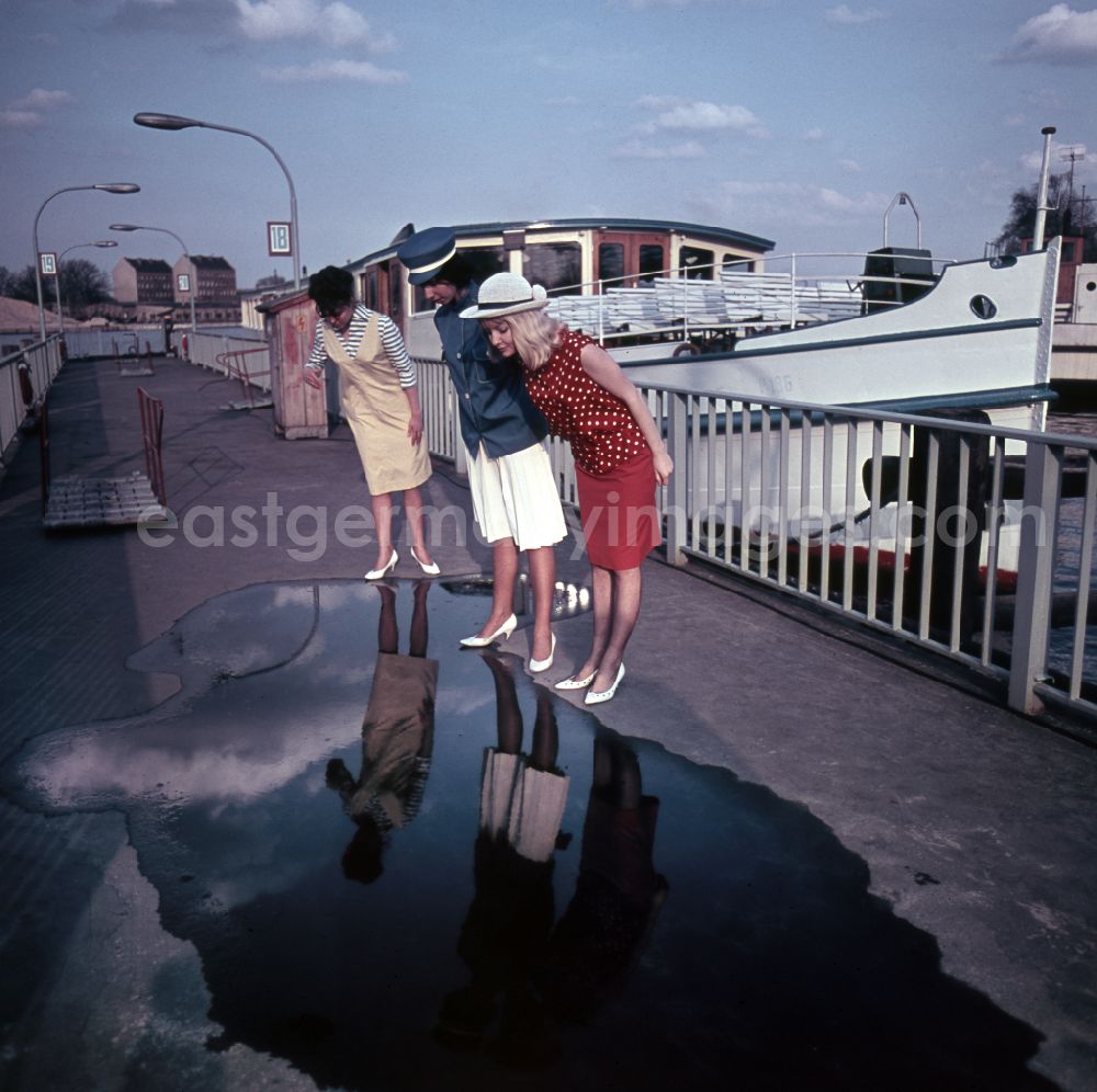 GDR photo archive: Berlin - Young women present the latest summer fashion in Eastberlin on the territory of the former GDR, German Democratic Republic. Sabine Bergmann-Pohl in a blue and white outfit