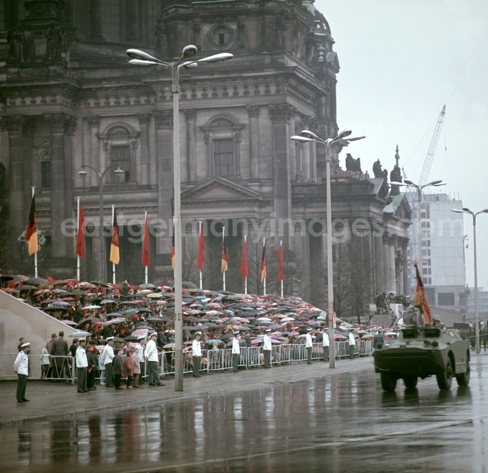 GDR picture archive: Berlin - Ein Panzerwagen der Nationalen Volksarmee der DDR fährt bei der Parade zum 1. Mai 1969 an den Zuschauern auf der Tribüne am Berliner Dom vorbei.
