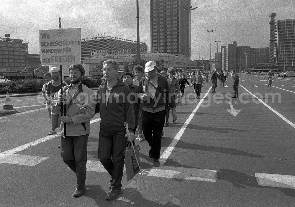 GDR photo archive: Berlin - Demonstration and street protest action 5. Berliner Friedenslauf on street Otto-Braun-Strasse in the district Mitte in Berlin Eastberlin on the territory of the former GDR, German Democratic Republic