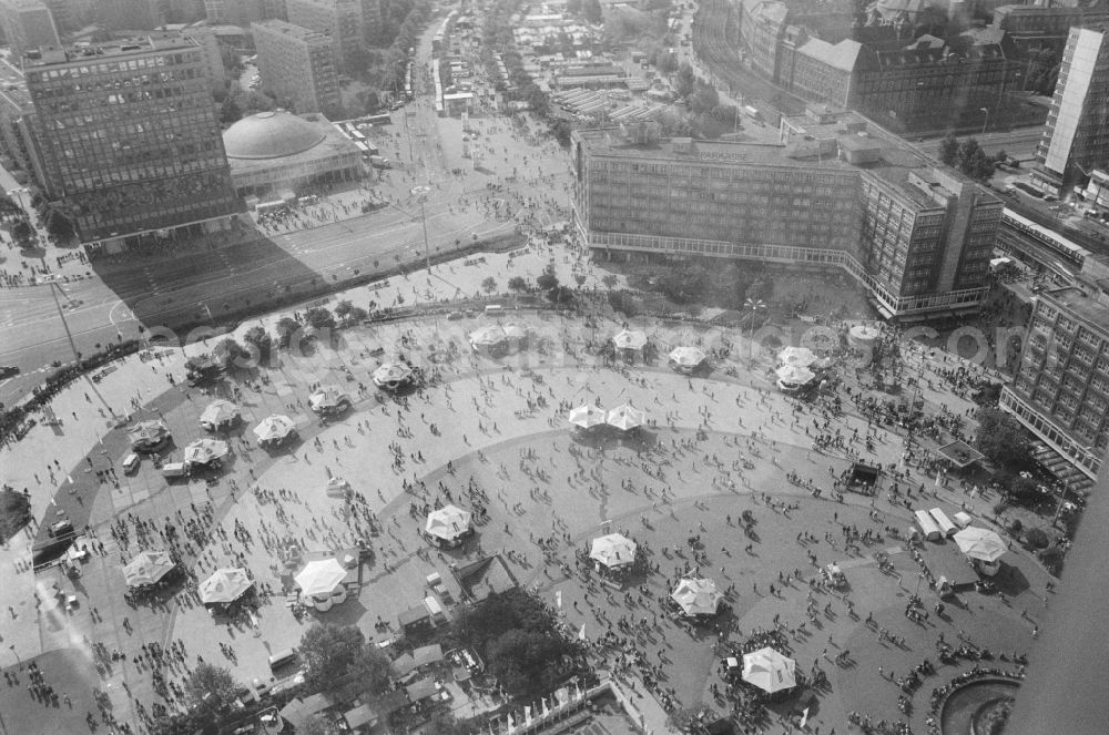 GDR picture archive: Berlin - The Alexanderplatz viewed from above in Berlin, the former capital of the GDR, the German Democratic Republic. In the background v.l.n.r. the house of the teacher, the Congress Hall, the headquarters of the Savings Bank and the Registry Office of Berlin-Mitte