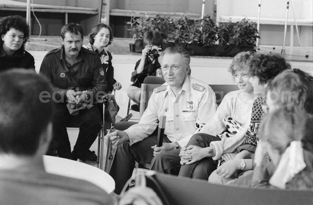 GDR photo archive: Berlin - The German astronaut, fighter pilot and major general of the NVA Sigmund Werner Paul Jaehn talking to young people at Pentecost meeting of youth in Berlin, the former capital of the GDR, the German Democratic Republic