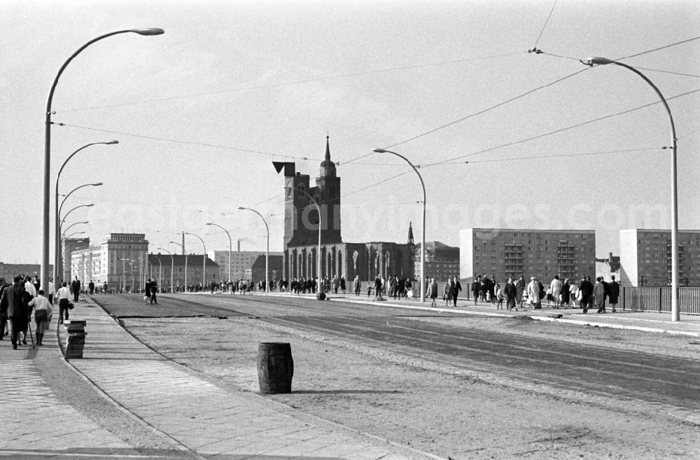 GDR photo archive: Magdeburg - The new river bridge over the river Elbe in Magdeburg connects downtown with the district Werder on the Red Horn peninsula. It was inaugurated in 1965. In the background is the St. John's church