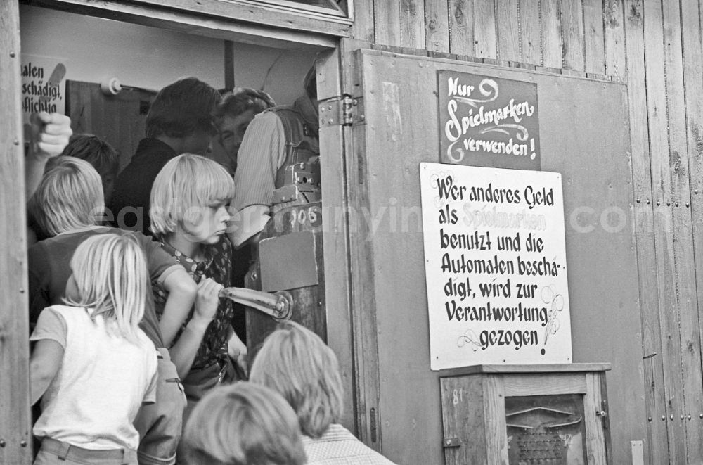 GDR image archive: Paaren - Residents and guests as participants in the events on the occasion of a village festival with fairground rides in Paaren, Brandenburg on the territory of the former GDR, German Democratic Republic