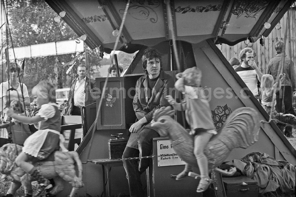 GDR picture archive: Paaren - Residents and guests as participants in the events on the occasion of a village festival with fairground rides in Paaren, Brandenburg on the territory of the former GDR, German Democratic Republic