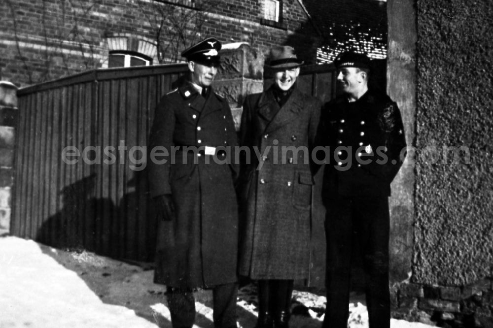 GDR photo archive: Merseburg - Three men in uniforms in Merseburg in the federal state Saxony-Anhalt in Germany