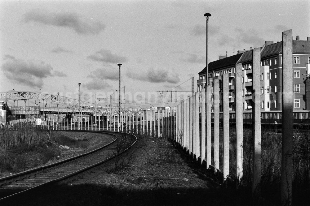 GDR photo archive: Berlin - Former course of the Wall at the S-Bahn station Bornholmer Strasse with view towards the center and the TV tower in Berlin - Prenzlauer Berg, the former capital of the GDR, German Democratic Republic
