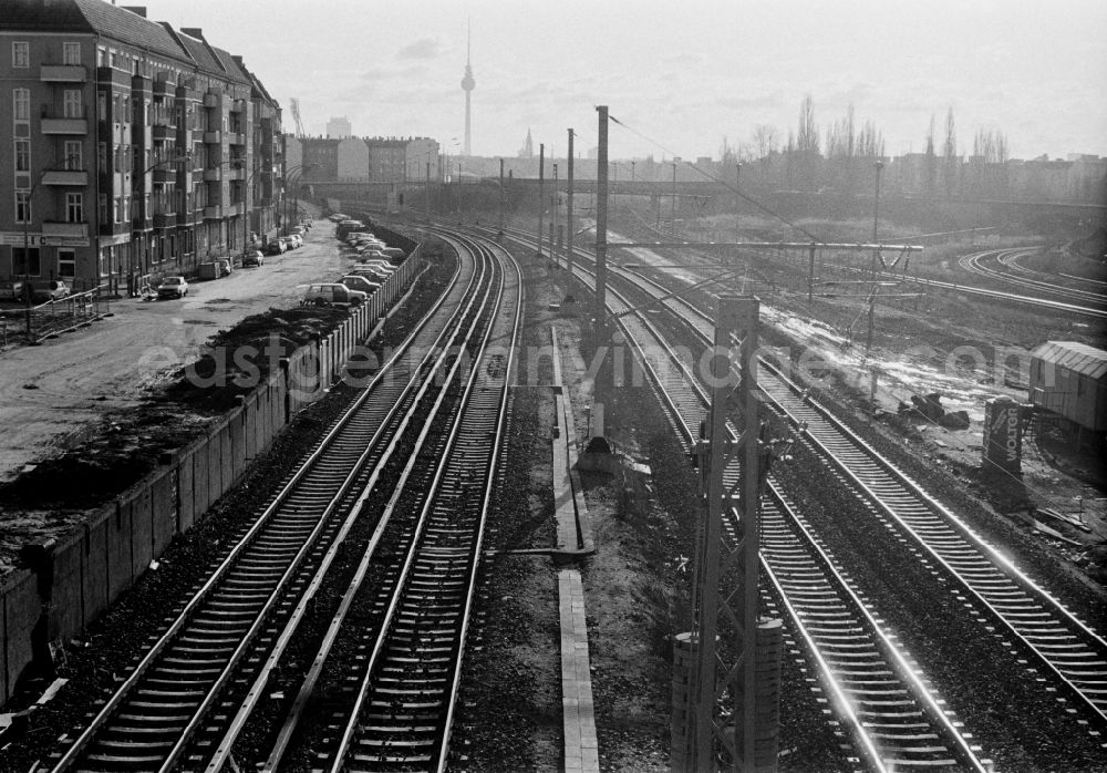 GDR picture archive: Berlin - Former course of the Wall at the S-Bahn station Bornholmer Strasse with view towards the center and the TV tower in Berlin - Prenzlauer Berg, the former capital of the GDR, German Democratic Republic