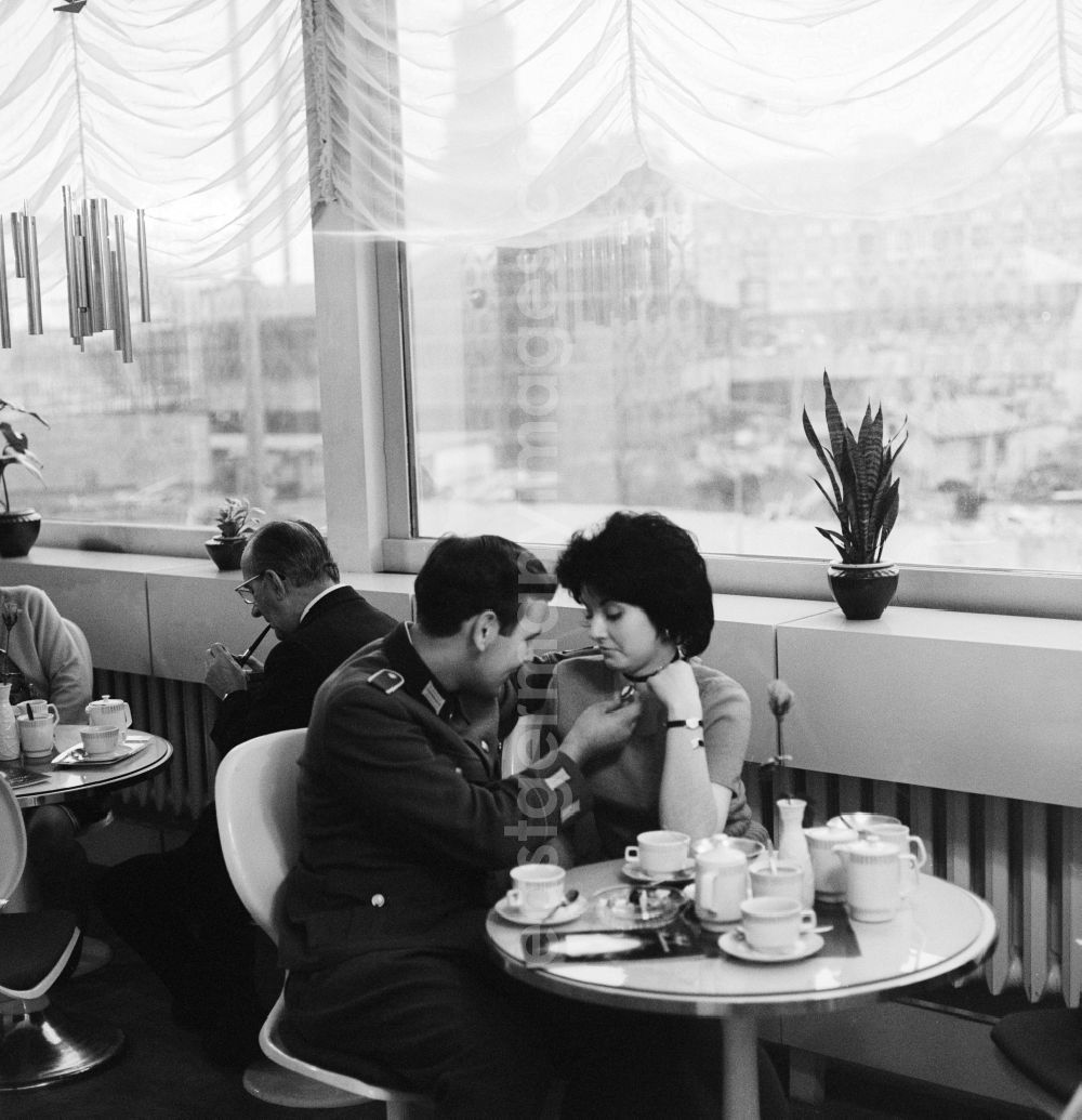GDR picture archive: Berlin - A soldier of the National People's Army (NVA) meets with his girlfriend in a cafe in Berlin, the former capital of the GDR, German Democratic Republic