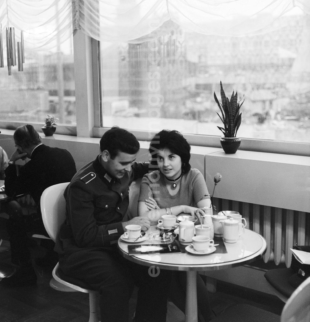 GDR image archive: Berlin - A soldier of the National People's Army (NVA) meets with his girlfriend in a cafe in Berlin, the former capital of the GDR, German Democratic Republic