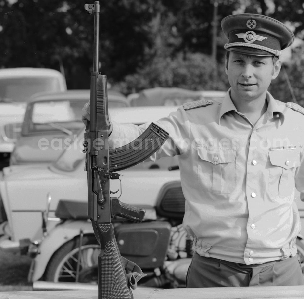GDR picture archive: Ferdinandshof - A major in the Air Force, LSK LV, the NVA with a rifle of the type KK-MPi 69 Kalashnikov in Ferdinandshof in Mecklenburg-Western Pomerania in the field of the former GDR, German Democratic Republic